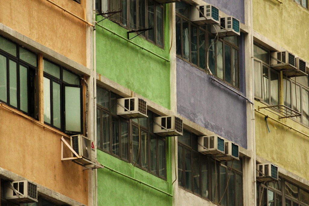 A wall of commercial air conditioners on an office block