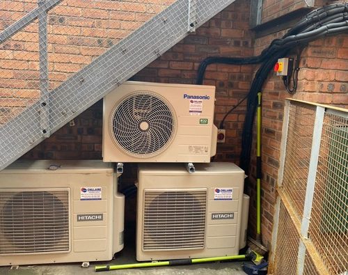 Air conditioning ventilation units outside brick building