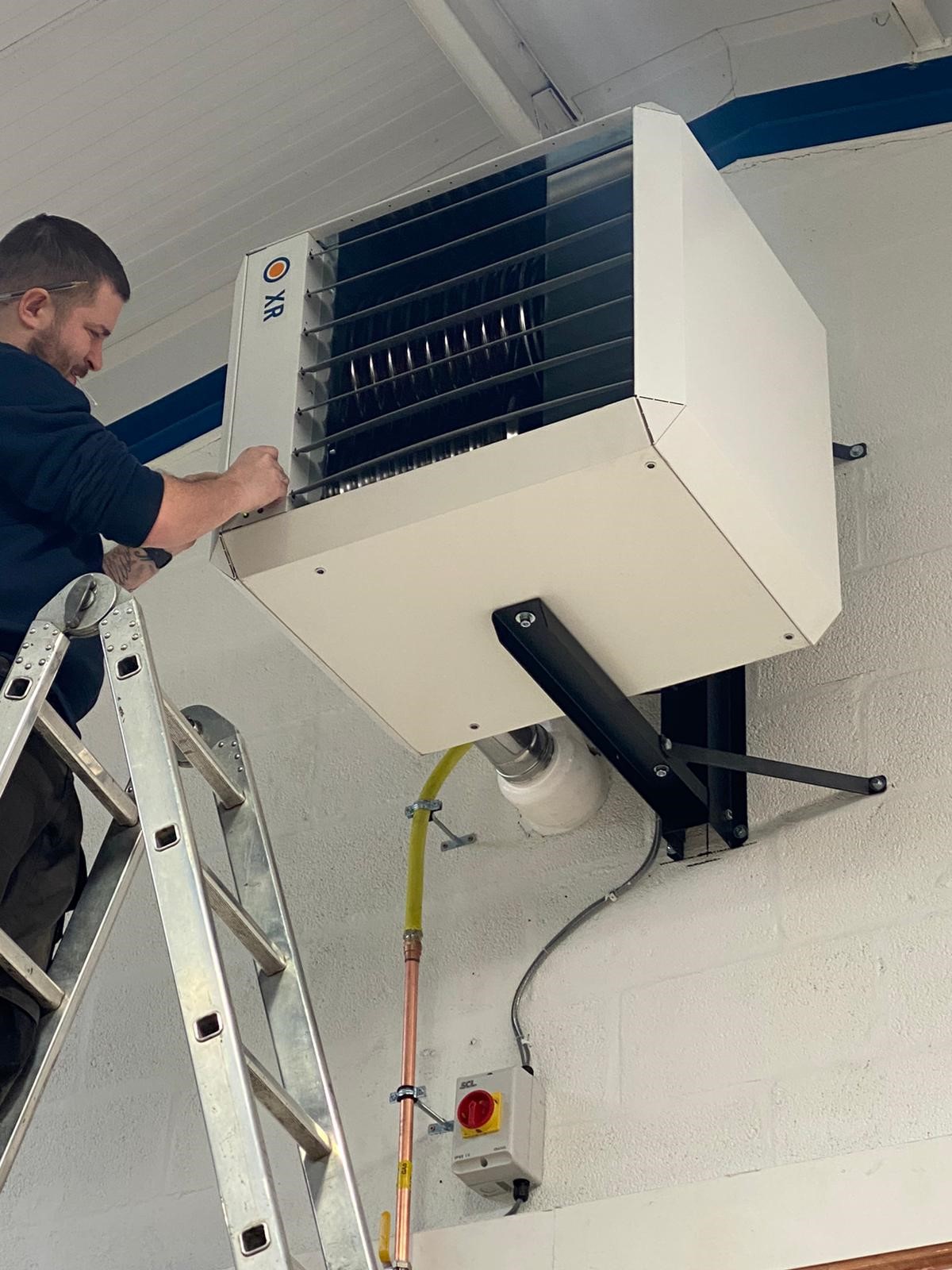 Man fixing air conditioning