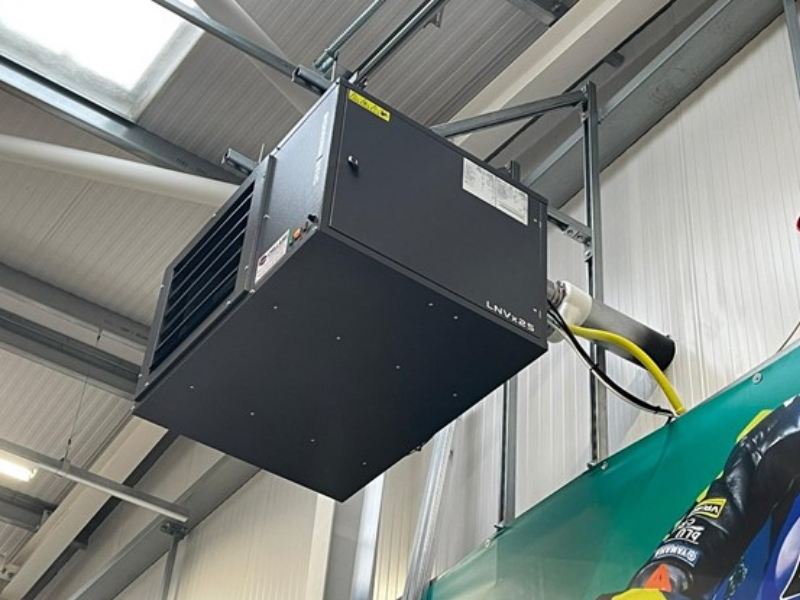Large air conditioning ventilation unit in warehouse building