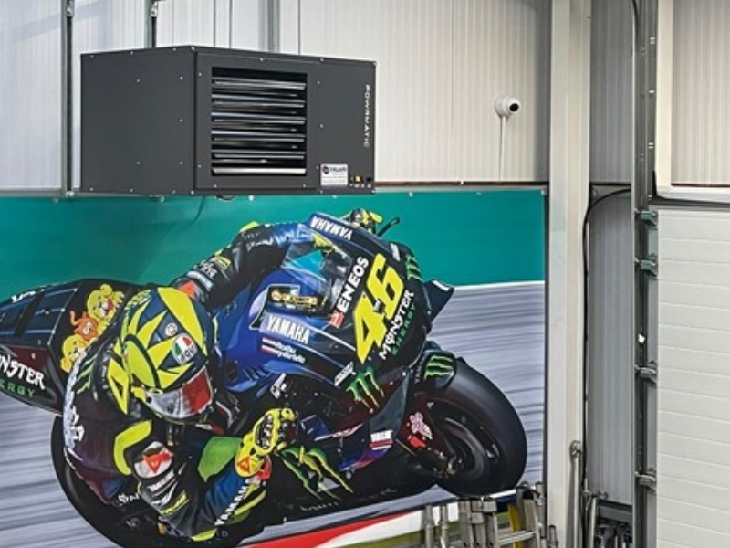 Industrial building with ventilation system and large motorcycle picture