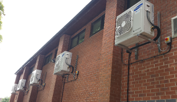 Air conditioning systems on brick wall