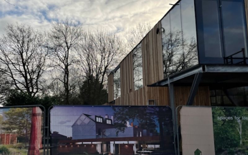 Wooden school building with glass