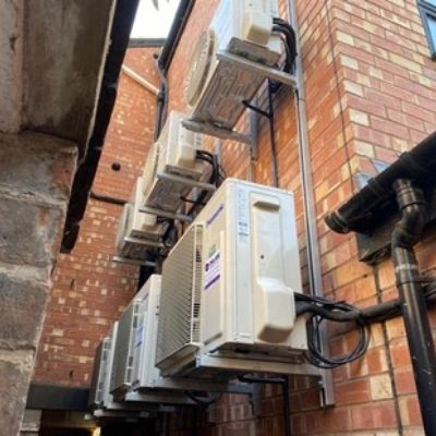 Air conditioning ventilation units outside brick building