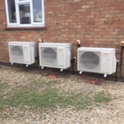 3 air conditioning units outside