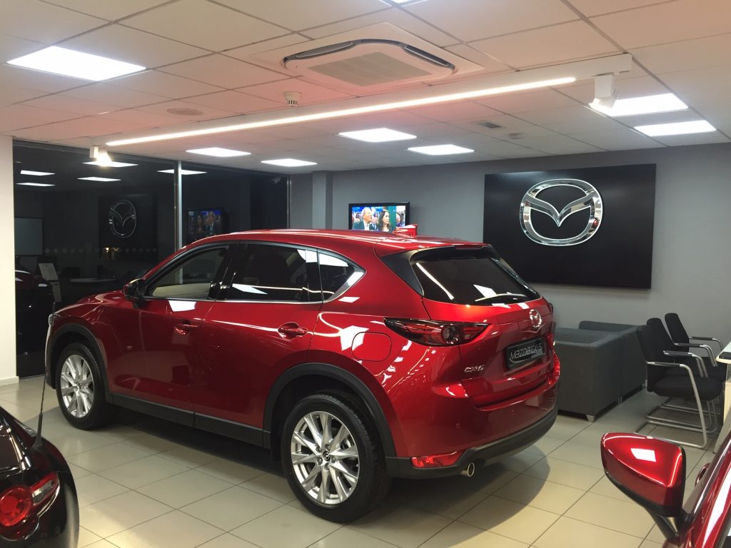 Mazda car with air conditioning above