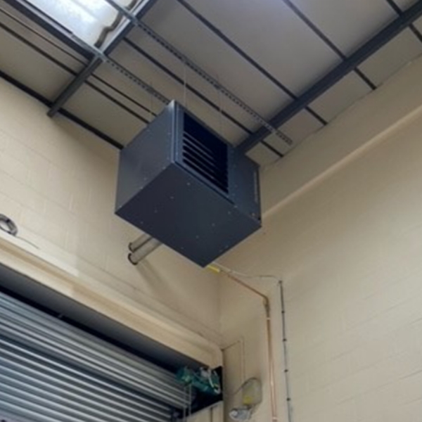 Powrmatic air ventilation system hanging from industrial building ceiling