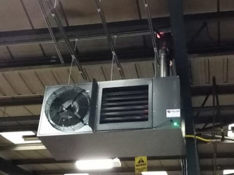 Silver air conditioning unit hanging from ceiling