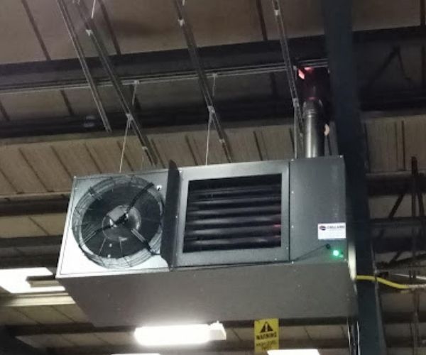Silver air conditioning unit hanging from ceiling