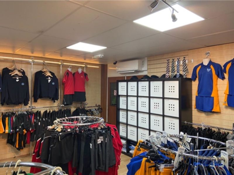 Inside sports shop with lockers and air conditioning unit