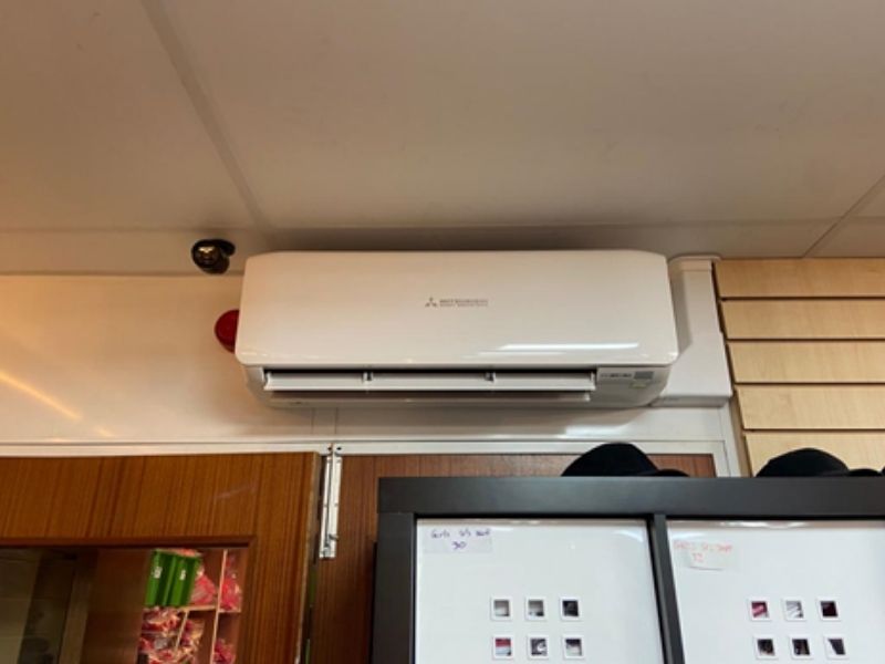 Heat pump air conditioning unit in locker room
