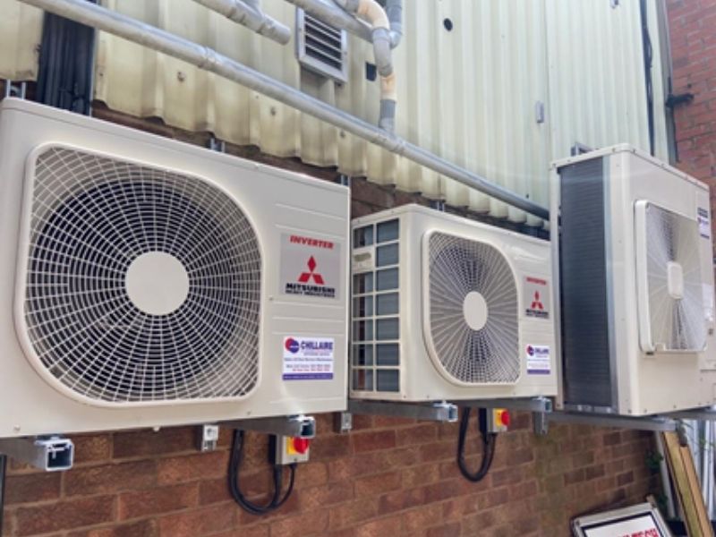 Mitsubishi air conditioning system outside on brick wall