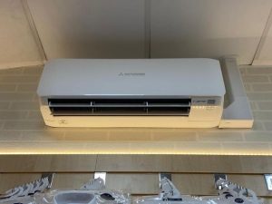 Air conditioning unit on brick wall