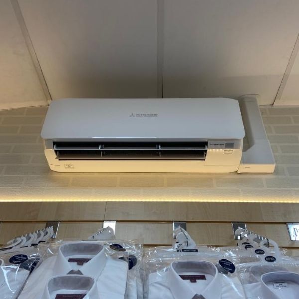 Air conditioning unit on brick wall in shop