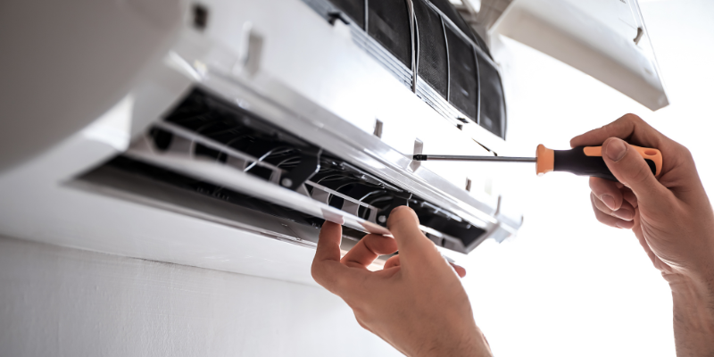 Man fixing air conditioning close up