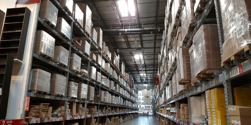 Warehouse with large parcels and wrapped cardboard boxes