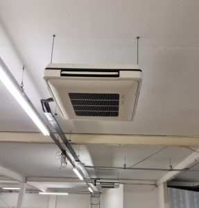 Air conditioning unit hanging from ceiling